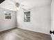 Bedroom with two windows and ceiling fan at 8501 47Th N St, Pinellas Park, FL 33781