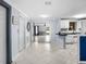 Inviting hallway leading to kitchen and living area with tile floors and neutral paint scheme at 8501 47Th N St, Pinellas Park, FL 33781