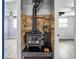 Wood burning stove with tiled accent wall at 8501 47Th N St, Pinellas Park, FL 33781
