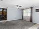 Comfortable living room with a ceiling fan, natural light, and a view of a stone fireplace at 8501 47Th N St, Pinellas Park, FL 33781