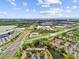 An aerial view highlights the community's proximity to major roads, commercial areas, and nearby water for convenience at 880 S Village Lake N Dr # 106, St Petersburg, FL 33716
