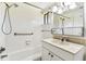 Bathroom with a single sink vanity and bathtub and shower at 880 S Village Lake N Dr # 106, St Petersburg, FL 33716