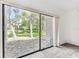 View from bedroom overlooking lush foliage and waterfront setting at 880 S Village Lake N Dr # 106, St Petersburg, FL 33716