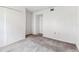 An empty bedroom with a closet and neutral carpet at 880 S Village Lake N Dr # 106, St Petersburg, FL 33716