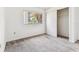A bedroom with a closet and window overlooking the trees outside at 880 S Village Lake N Dr # 106, St Petersburg, FL 33716