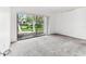 Spacious room with large window overlooking a serene water view at 880 S Village Lake N Dr # 106, St Petersburg, FL 33716