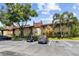 A well-maintained building with reserved parking spaces and mature trees in Village Lake Condominiums at 880 S Village Lake N Dr # 106, St Petersburg, FL 33716