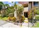 A charming condo entrance surrounded by colorful plants and greenery at Village Lake Condominiums at 880 S Village Lake N Dr # 106, St Petersburg, FL 33716