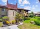 Charming exterior with well-manicured landscaping, providing a welcoming curb appeal and a serene atmosphere at 880 S Village Lake N Dr # 106, St Petersburg, FL 33716