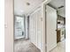 Hallway with closet leading to the kitchen and bathroom featuring tiled and carpeted floors at 880 S Village Lake N Dr # 106, St Petersburg, FL 33716