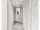 Hallway view featuring storage and bathroom access at 880 S Village Lake N Dr # 106, St Petersburg, FL 33716