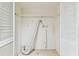 An empty laundry closet with white shelving awaiting your personal touch to make it your own laundry space at 880 S Village Lake N Dr # 106, St Petersburg, FL 33716
