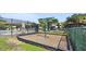 Community playground and swing set surrounded by well-maintained green space at 880 S Village Lake N Dr # 106, St Petersburg, FL 33716