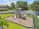 Community playground area featuring slides and climbing structures surrounded by green space at 880 S Village Lake N Dr # 106, St Petersburg, FL 33716