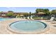 Outdoor hot tub surrounded by lounge chairs near a community building at 880 S Village Lake N Dr # 106, St Petersburg, FL 33716