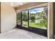 A screened patio has views of a pond with a fountain, accessible by a staircase, creating a peaceful retreat at 880 S Village Lake N Dr # 106, St Petersburg, FL 33716