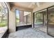 A screen patio provides relaxing views of the lake while offering an inviting space for outdoor enjoyment at 880 S Village Lake N Dr # 106, St Petersburg, FL 33716