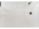 A simple shower design is shown with white tiles and a shower head at 880 S Village Lake N Dr # 106, St Petersburg, FL 33716