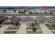 Aerial view of single-Gathering homes with well-maintained lawns and driveways at 11210 Kelly Green Ave, Wimauma, FL 33598