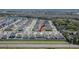 Aerial view of the neighborhood with a lush green landscape at 11210 Kelly Green Ave, Wimauma, FL 33598