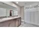 Bathroom featuring a double vanity, granite countertops, and shower with tub at 11210 Kelly Green Ave, Wimauma, FL 33598