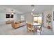 Cozy living space featuring a dining table, and a stylish sofa at 11210 Kelly Green Ave, Wimauma, FL 33598