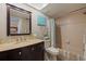 Well-lit bathroom with vanity, toilet and shower-tub combination at 1304 Pasadena S Ave # 3, South Pasadena, FL 33707