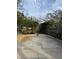 Backyard featuring a basketball court and a wooden fence at 2450 Roberta Ln, Clearwater, FL 33764