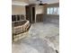Partially renovated living room with ceiling fan and natural light at 2450 Roberta Ln, Clearwater, FL 33764