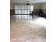 Spacious living room with large windows for ample natural light and a wet bar at 2450 Roberta Ln, Clearwater, FL 33764