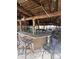 Tiki hut featuring an outdoor kitchen with a stone countertop and barstool seating at 2450 Roberta Ln, Clearwater, FL 33764