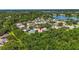 Aerial photo of neighborhood with property location marked by red pin, showing proximity to lake at 4251 Whittner Dr, Land O Lakes, FL 34639