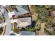 Overhead view of the house showing roof, driveway, sidewalk, and landscaping at 4251 Whittner Dr, Land O Lakes, FL 34639