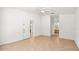 Open bedroom with tile flooring leading to en-suite bathroom and walk-in closet at 4251 Whittner Dr, Land O Lakes, FL 34639