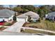Charming one-story home with a well-manicured lawn, a two car garage, and a traditional architectural style at 4251 Whittner Dr, Land O Lakes, FL 34639