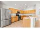 Spacious kitchen with stainless steel appliances, ample wood cabinets, and tile flooring at 4251 Whittner Dr, Land O Lakes, FL 34639