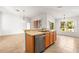 Bright kitchen featuring stainless steel dishwasher, double sink, and open layout to living spaces at 4251 Whittner Dr, Land O Lakes, FL 34639