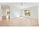Living room with tile flooring, large windows, and open to other areas via arched openings at 4251 Whittner Dr, Land O Lakes, FL 34639