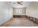 Bright bedroom featuring wood floors, a ceiling fan, and large closet at 710 S Davis Blvd, Tampa, FL 33606