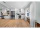 Charming kitchen with hardwood floors, stainless steel fridge, white cabinets and mini wine cooler at 710 S Davis Blvd, Tampa, FL 33606