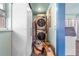 Laundry area with a stackable washer and dryer, and ample storage space at 710 S Davis Blvd, Tampa, FL 33606