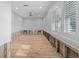 Bright living room featuring wood floors and large window with charming shutters at 710 S Davis Blvd, Tampa, FL 33606