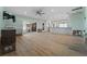 Bright and airy living space with hardwood floors, recessed lights, and an open layout to the kitchen at 710 S Davis Blvd, Tampa, FL 33606