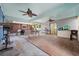 Large screened-in outdoor patio area with tile flooring and multiple seating areas at 710 S Davis Blvd, Tampa, FL 33606