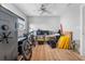 Spacious storage area with hardwood floors, ceiling fan, and a large security safe at 710 S Davis Blvd, Tampa, FL 33606