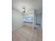 Cozy dining area with tile flooring, decorative light fixture, and an open kitchen view at 8608 Lake Isle Dr # 0, Temple Terrace, FL 33637