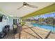 Indoor pool with an eating area. A TV, and lots of natural lighting at 952 Symphony Isles Blvd, Apollo Beach, FL 33572