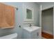 Bathroom featuring a modern vanity with a sink, mirrored cabinet, and a soft orange towel at 2418 2Nd S Ave, St Petersburg, FL 33712