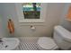 Bathroom with a white toilet, bidet, and black and white tile floor at 2418 2Nd S Ave, St Petersburg, FL 33712