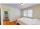 Cozy bedroom with wood floors and plenty of natural light from the window at 2418 2Nd S Ave, St Petersburg, FL 33712